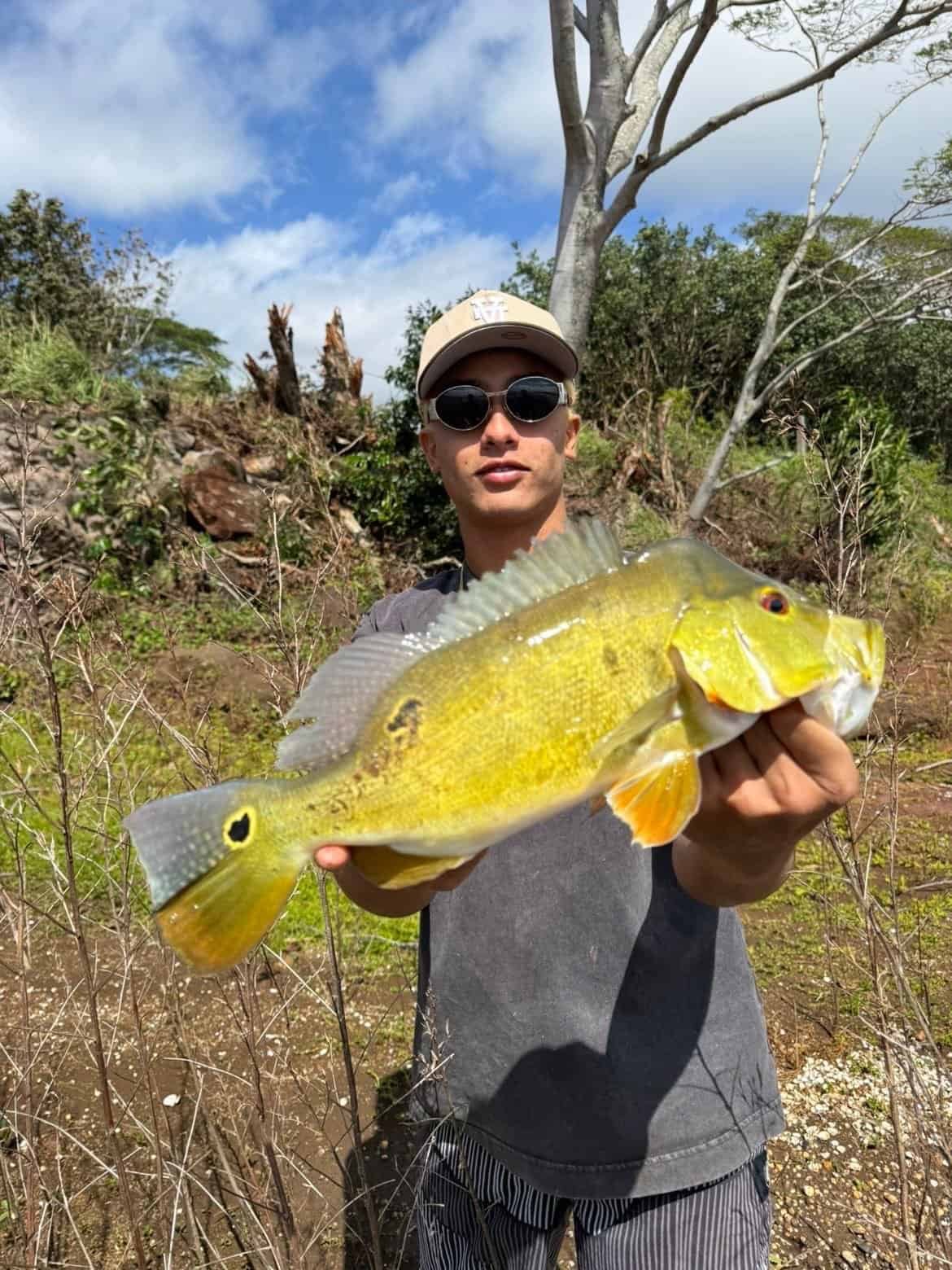 man holding a large yellow fish